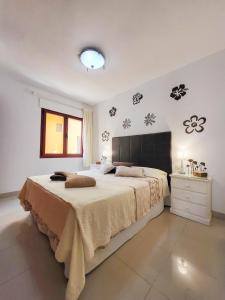 Posteľ alebo postele v izbe v ubytovaní MEDANO4YOU Red Mountain Sea View Holiday Home