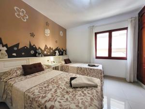 Posteľ alebo postele v izbe v ubytovaní MEDANO4YOU Red Mountain Sea View Holiday Home