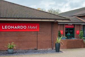 a sign for a lelandado hotel on a brick building at Leonardo Hotel East Midlands Airport in Castle Donington