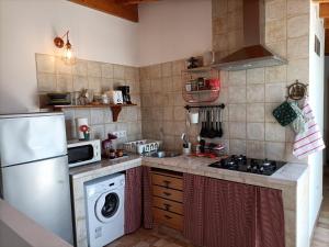 Η κουζίνα ή μικρή κουζίνα στο Penthouse Sunset View Tajao
