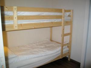 a couple of bunk beds in a room at Boost Your Immo Bois De Marie Barèges PM9 in Barèges