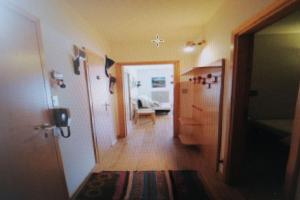 a hallway of a home with a room with a hallway at La casa di Antonello Chiara Alessandro e Ginevra in Malga Ciapela