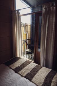 Postel nebo postele na pokoji v ubytování Hotel & Café Bauda
