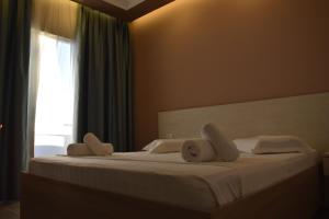 Postel nebo postele na pokoji v ubytování Hotel Qetesia-Te Indriti