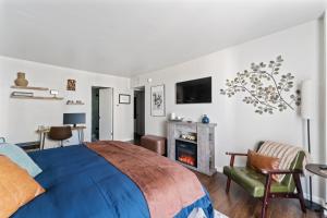 a bedroom with a bed and a fireplace at Panorama Place in Reno