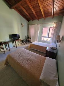 Una cama o camas en una habitación de Hotel Pórtico Norte