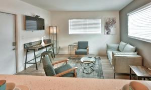 a living room with a couch and a table at Krymwood Flats Wynwood in Miami