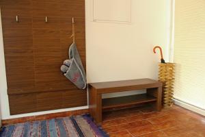 a corner of a room with a table and a door at Private holiday house Vivendi in Liptovský Mikuláš