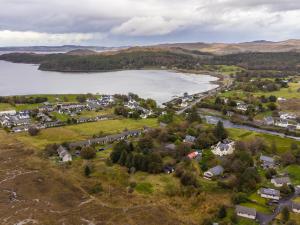 an aerial view of a small town next to a lake at The Cottage at Corriness House in Achnasheen