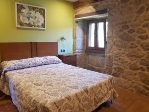 A bed or beds in a room at Vibes Coruña- Casa Corredoira