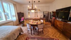 a kitchen and dining room with a table and chairs at GOLDIE in Zagreb