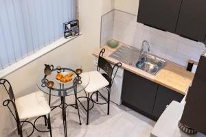 Kuchyňa alebo kuchynka v ubytovaní Duplex Ivoire au coeur de Montauban