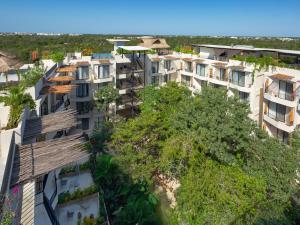 an overhead view of a building with trees at Naala Tulum in Tulum