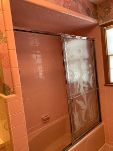 a shower with a glass door in a bathroom at #1 Bright Private Room near New Brunswick, NJ downtown in New Brunswick