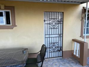 a door with a chair in front of a building at Boscobel Hideaway in Boscobel