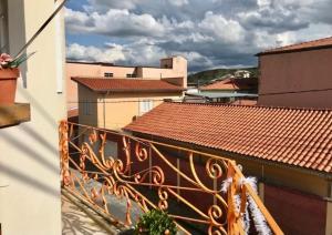 a view of a balcony of a building with roofs at Hospedaria Casa Real in Santa Cruz de Minas