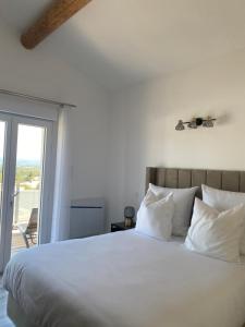 Postel nebo postele na pokoji v ubytování O Bain Soleil
