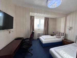 Postel nebo postele na pokoji v ubytování Hotel Austria