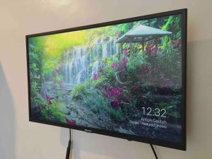 TV con una foto de jardín en Condo , WIFI up to 100mbps , Infinity Pool, en Cebú 47 fotos más