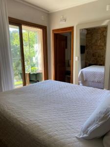 Locanda Montecielo - Vale dos Vinhedos客房内的一张或多张床位
