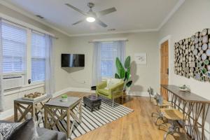 a living room with a couch and a tv at Cooper Young Bungalow with All the Essentials in Memphis