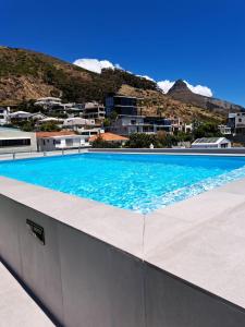 a large swimming pool on top of a building at The Marlo Apartment in Cape Town