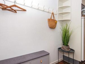 a kitchen with a plant on a wall at Holiday Home Golfvejen VII in Fanø