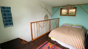 Een bed of bedden in een kamer bij Granja Tzikin