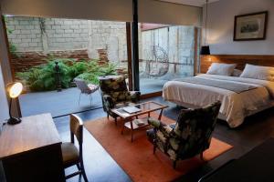Postel nebo postele na pokoji v ubytování Augusta Hotel