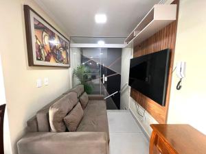 TV a/nebo společenská místnost v ubytování Cobertura Luxo com Jacuzzi Orla Praia Grande
