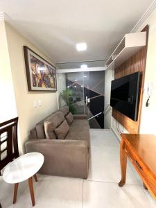 TV a/nebo společenská místnost v ubytování Cobertura Luxo com Jacuzzi Orla Praia Grande