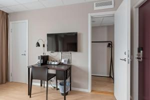 TV a/nebo společenská místnost v ubytování Best Western Plus Park Airport Hotel