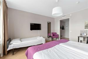 Postel nebo postele na pokoji v ubytování Best Western Plus Park Airport Hotel