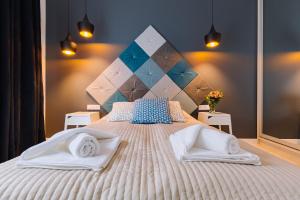 Posteľ alebo postele v izbe v ubytovaní ApartmentPrestige Central Station