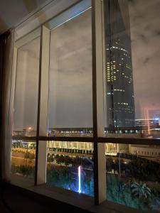 a view of a city skyline from a window at داماك برماونت in Riyadh