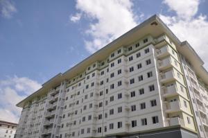 a large white apartment building with the sky in the background at Amaia Steps Altaraza Staycation in Sapang Alat