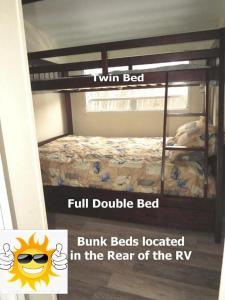 a poster of a bunk bed with the words twin bed full double bed bump beds at Boardwalk RV Rental Site #19 in Cavendish