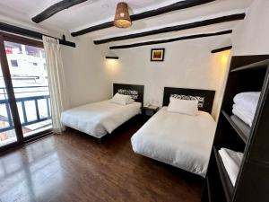 A bed or beds in a room at Hatun Inti Classic