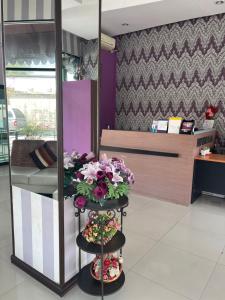 a flower shop with a display of flowers on display at Grand Residence Jomtien in Jomtien Beach