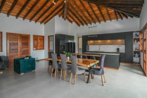 a kitchen with a wooden table and chairs at San Miguel de Montenegro in Montenegro
