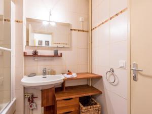 a bathroom with a sink and a mirror and a shower at Studio Val-d'Isère, 1 pièce, 4 personnes - FR-1-694-175 in Val-d'Isère