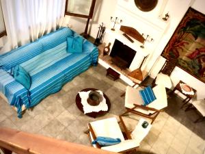 an overhead view of a bedroom with a bed and chairs at Agrampeli in Limenaria
