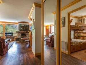 two views of a living room and a dining room at Appartement Val-d'Isère, 4 pièces, 6 personnes - FR-1-694-213 in Val-d'Isère