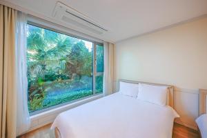 Postel nebo postele na pokoji v ubytování Harmony Resort + 26 fotografií