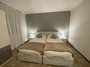 Letto o letti in una camera di Albergo Stazione
