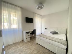 Letto o letti in una camera di Albergo Stazione