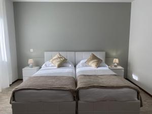 Letto o letti in una camera di Albergo Stazione