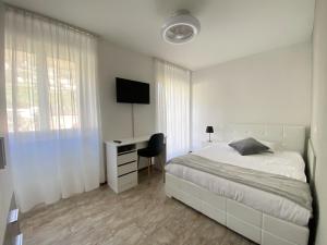 Letto o letti in una camera di Albergo Stazione