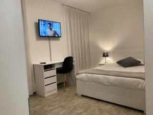 Letto o letti in una camera di Albergo Stazione