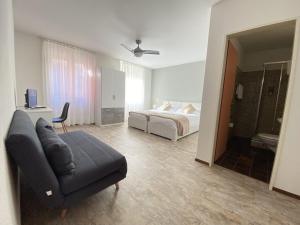 Letto o letti in una camera di Albergo Stazione